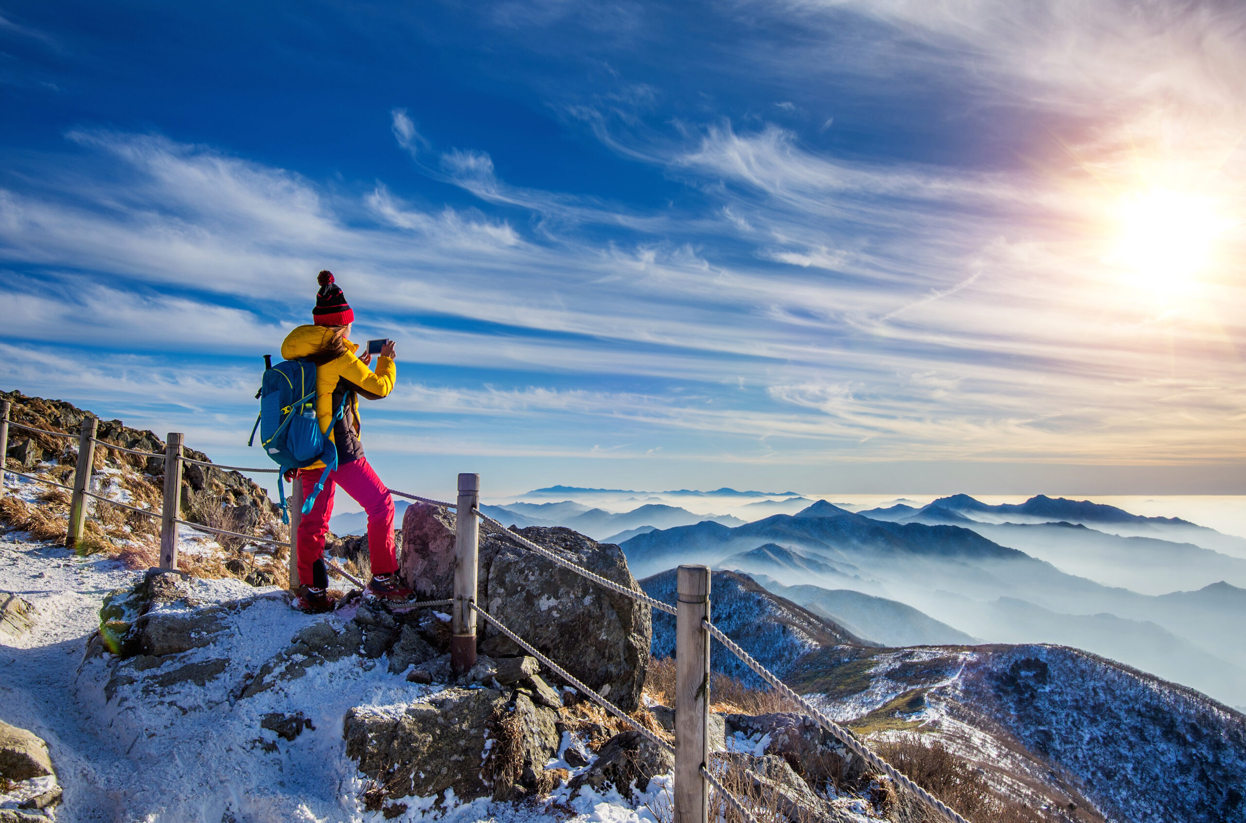 Mussoorie across different seasons showcasing blooming flowers in spring, green hills in summer, monsoon rains, and snow-covered landscapes in winter