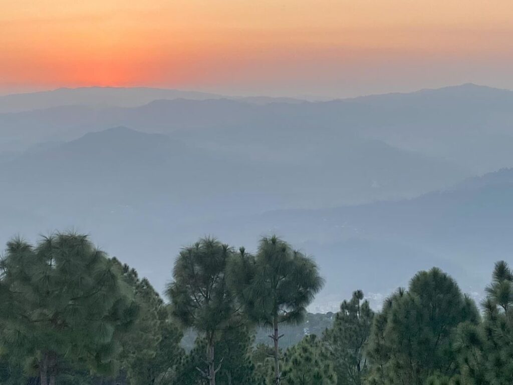 Kasar Devi Temple Almora with Himalayan backdrop and pine forest